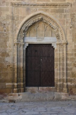 Detail of an inn door and stone walls from the Ottoman medieval period. Ottoman architecture mosque entrance door