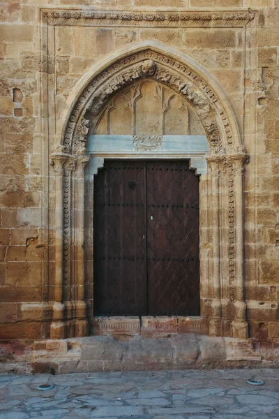 Detail of an inn door and stone walls from the Ottoman medieval period. Ottoman architecture mosque entrance door