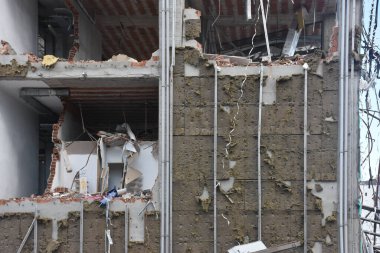 Remains of a building destroyed in the earthquake; rubble and rubble heap, stone, earth. Dramatic post-earthquake view