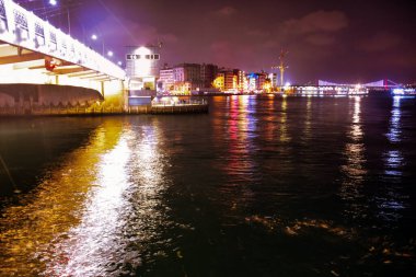 Bosphorus bridge and city view from under the historical Galata tower with night lights. Istanbul night life wallpaper