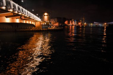 Bosphorus bridge and city view from under the historical Galata tower with night lights. Istanbul night life wallpaper