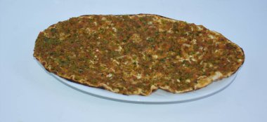 Close up of Lahmacun served on the plate, made with minced meat