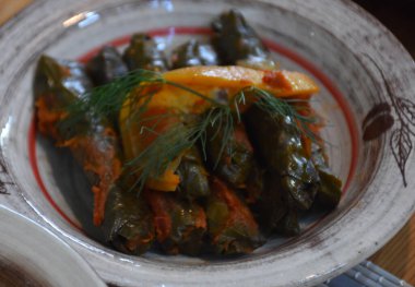 Close up view a plate of Yaprak sarma from the Turkish cuisine. Sarma, Stuffed Grape Leaves
