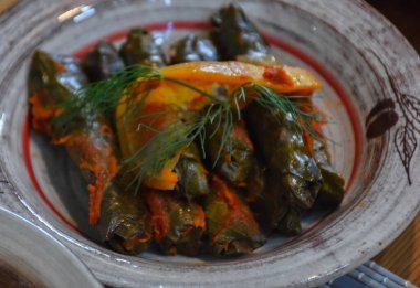 Close up view a plate of Yaprak sarma from the Turkish cuisine. Sarma, Stuffed Grape Leaves