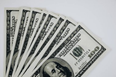 One hundred dollar banknotes isolated on white background.   isolated stacked hundred dollar bills