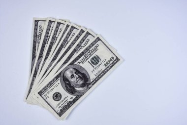 One hundred dollar banknotes isolated on white background.   isolated stacked hundred dollar bills