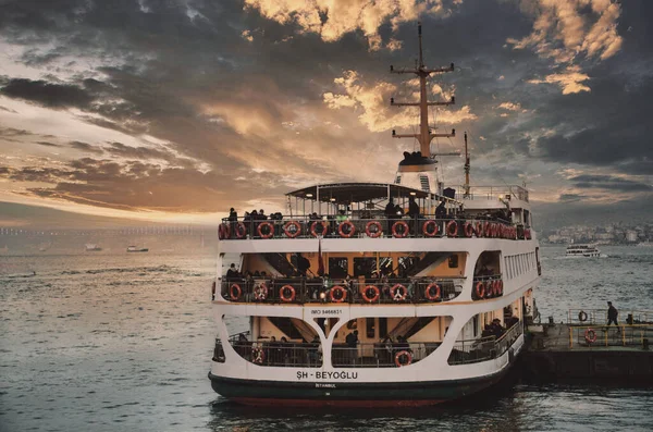 The ferry that picks up its passengers at Karakoy Pier in Istanbul and a fishing rod thrown into the sea at the historical Galata Bridge. Istanbul wallpaper