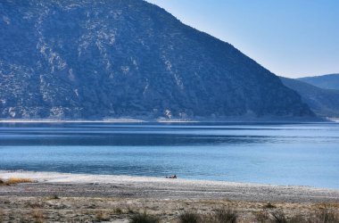 Beach of Salda Lake, in Burdur Turkey. People enjoying the beach.The lake sedimentary records show high resolution climate changes that are related to solar variability during the last millennium