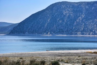 Beach of Salda Lake, in Burdur Turkey. People enjoying the beach.The lake sedimentary records show high resolution climate changes that are related to solar variability during the last millennium