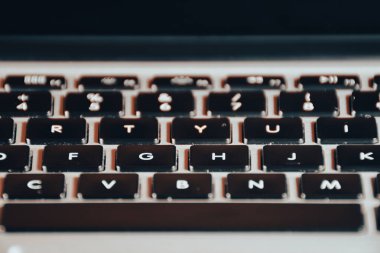 Extreme close up of black and gray  modern laptop keyboard