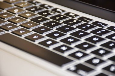 Extreme close up of black and gray  modern laptop keyboard