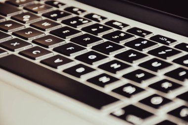 Extreme close up of black and gray  modern laptop keyboard