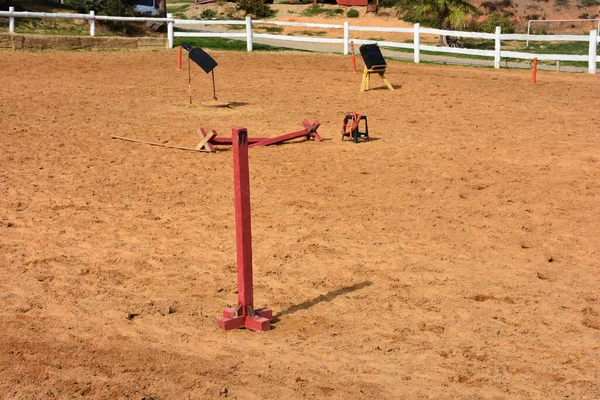 Horse riding training equipments on training track at horse farm. Equestrian training equipments