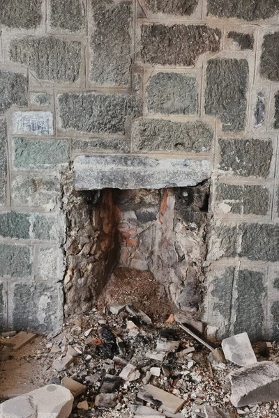 old stone fireplace in an abandoned house