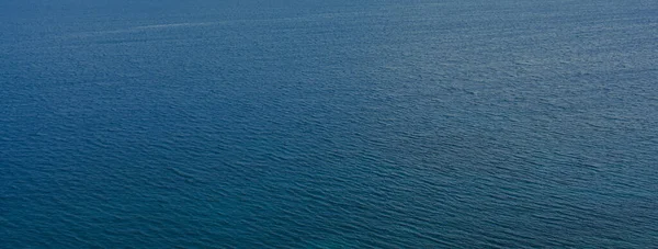 Top view of blue turquoise sea of magnificent Aegean sea. Watersurface view of the Aegean sea. Facebook cover, wallpaper, copy space