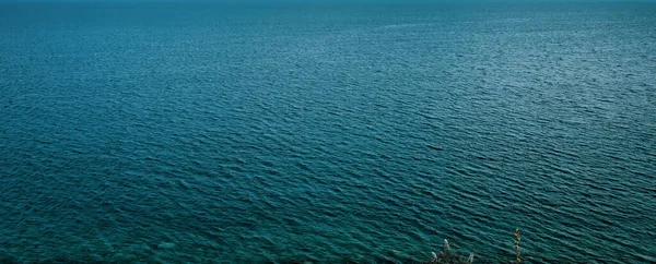 Top view of blue turquoise sea of magnificent Aegean sea. Watersurface view of the Aegean sea. Facebook cover, wallpaper, copy space