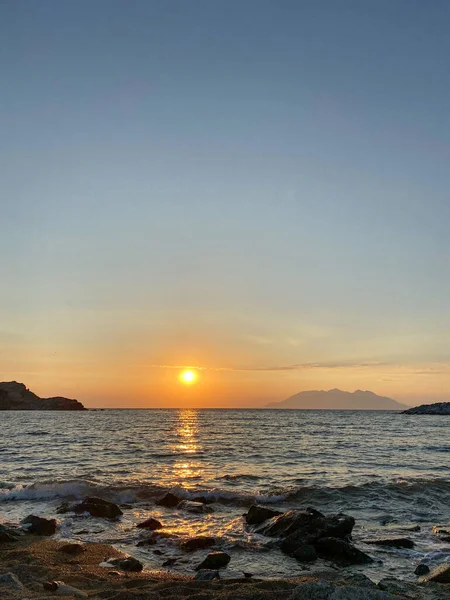 stock image Distant view of Samothrace island at sunset from Yildizkoy beach on Imbros Gokceada, Canakkale Turkey