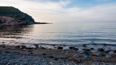 Gökçeada 'da gün batımında, Yunanca adı Arcadia olan Yıldız Koy plajı, Gökçeada' da popüler bir plajdır. Çanakkale, Türkiye