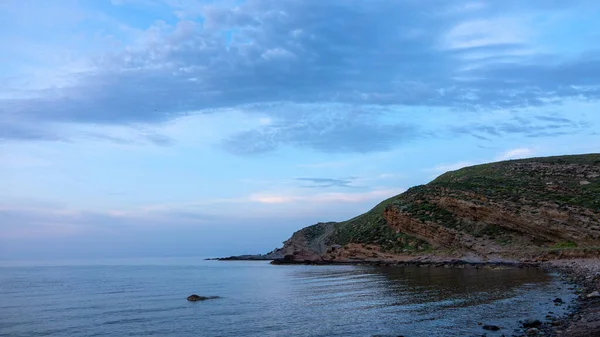 stock image Yildizkoy beach view from the green hills of Gokceada at sunset,  Yildizkoy coast is the one of popular beach in Gokceada. Canakkale, Turkey