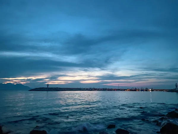 stock image Kalekoy lighthouse and beach view at sunset of Gokceada Imbros island kalekoy harbor. Canakkale, Turkey