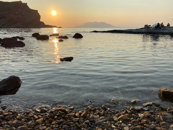 Gökceada, Imbros Adası 'nda gün batımında Yildizkoy plajı manzarası. Yildizkoy, Gökceada 'da popüler bir plajdır. Çanakkale, Türkiye