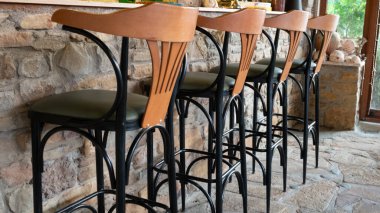 Restaurant bar with chairs lined up waiting for customers for summer parties in Aegean island 