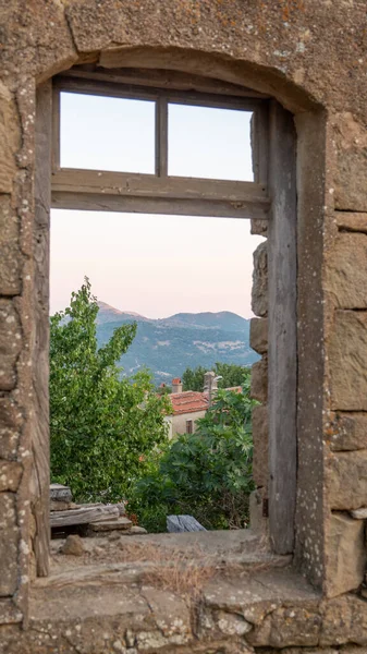 stock image  Ruined house wall and window in the Greek village of Tepeky (Agridia), one of the most touristic places of Gokceada - Turkish Aegean Island Gokceada. Canakkale, Turkey