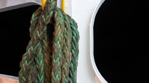 Mooring rope on the deck of a cruise ship at night. Boat interior