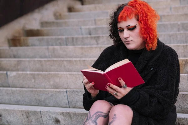 Transgender Girl Red Hair Reading Red Book — Stock Photo, Image