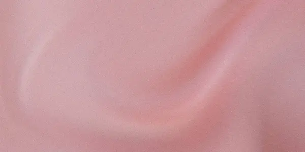 Yumuşak gül rengi yumuşak desenli kumaşın yakın çekim görüntüsü zarif ve lüks bir tasarım sergiliyor.