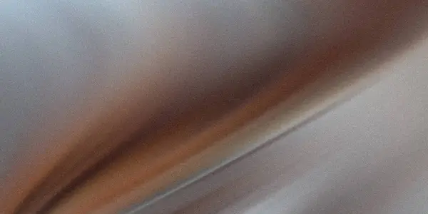 Bu görüntü, hafif desenli bir etki ve hareket ya da derinlik gösteren çapraz bir çizgi içeren, soluk kahverengiden açık griye geçiş eğilimini gösteriyor..