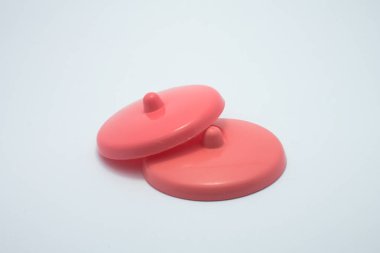 red plastic cup lid on white background