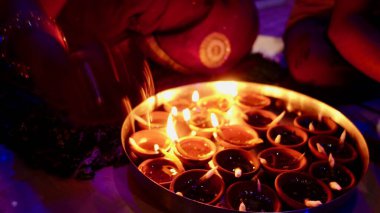 Clay diya lamps lit during diwali celebration, Diwali, or Dipawali, is India's biggest and most important holiday. clipart