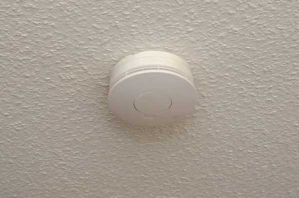 Fire alarm sensor on the ceiling in the living room