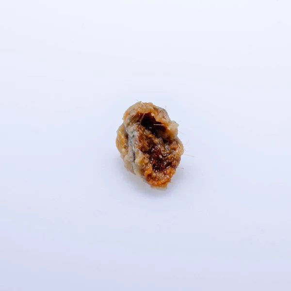 human ear wax on white background