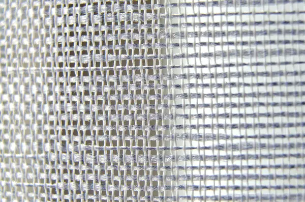 Tekstil arkaplanı veya duvar kağıdı tasarımı için yakın görüntüde beyaz dokuma kumaş dokusu