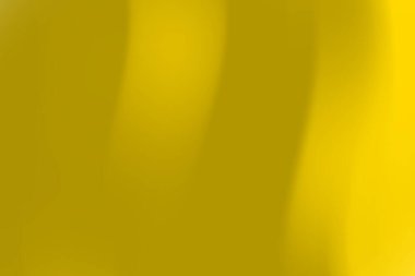 Pürüzsüz eğimli soyut sarı arkaplan sıcak ve davetkar bir atmosfer yaratıyor.