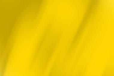 Pürüzsüz gradyan ve ışık yansımaları oluşturan parlak sarı soyut arkaplan derinlik