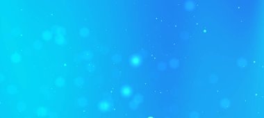 Yumuşak bokeh efektleri ve ışık parçacıkları ile soyut mavi arkaplan sakin bir atmosfer oluşturur