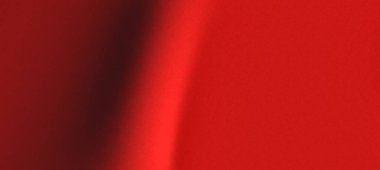 Pürüzsüz kırmızı kumaş kumaş zarif, yumuşak dokular ve canlı renkler sergiliyor. Moda tasarımı için ideal.