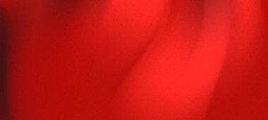 Canlı kırmızı kumaş zarif bir şekilde akıyor, yumuşak bir arkaplanda hareket ve sıcaklık hissi yaratıyor.