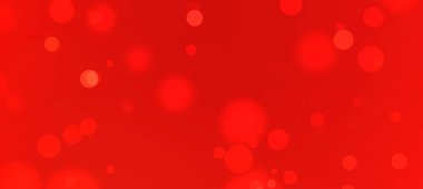 Yumuşak, parlak daireleri olan soyut kırmızı zemin canlı ve dinamik bir atmosfer yaratıyor.