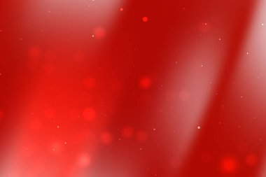 Yumuşak bokeh ışıkları olan canlı kırmızı soyut arka plan neşeli bir atmosfer yaratıyor.