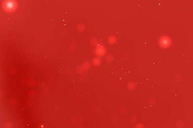 Yumuşak bokeh ışıklarıyla soyut kırmızı zemin, sıcak ve davetkar bir atmosfer yaratıyor.