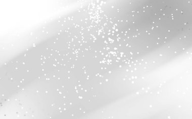 Yumuşak ışık ve dağınık parçacıklar ile soyut arkaplan rüya gibi bir atmosfer yaratıyor