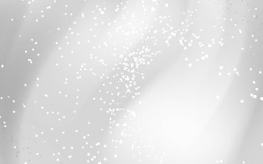Yumuşak eğimli soyut gri arkaplan ve kar tanelerine benzeyen dağınık beyaz noktalar.