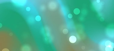 Yeşil ve mavi renkli yumuşak bokeh ışıkları içeren soyut bir arka plan, sakin bir atmosfer yaratıyor.