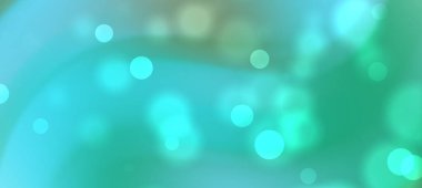 Yeşil ve mavi renkli yumuşak bokeh ışıkları olan soyut bir arka plan, rüya gibi bir atmosfer yaratıyor.