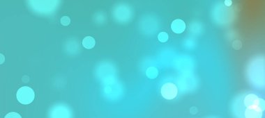 Yuvarlak ışık desenli yumuşak mavi bokeh arka plan rüya gibi bir atmosfer yaratıyor.