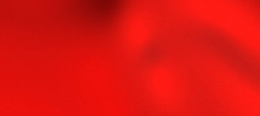 Canlı kırmızı kumaş zarif bir şekilde örtülmüş, pürüzsüz bir dokuya ve yumuşak bir ışıkta zengin bir renge sahip.